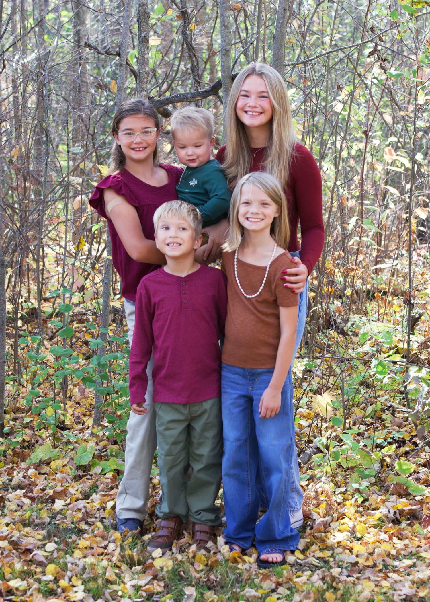 Professional family portrait photographer in Northern Minnesota photographing parents and children