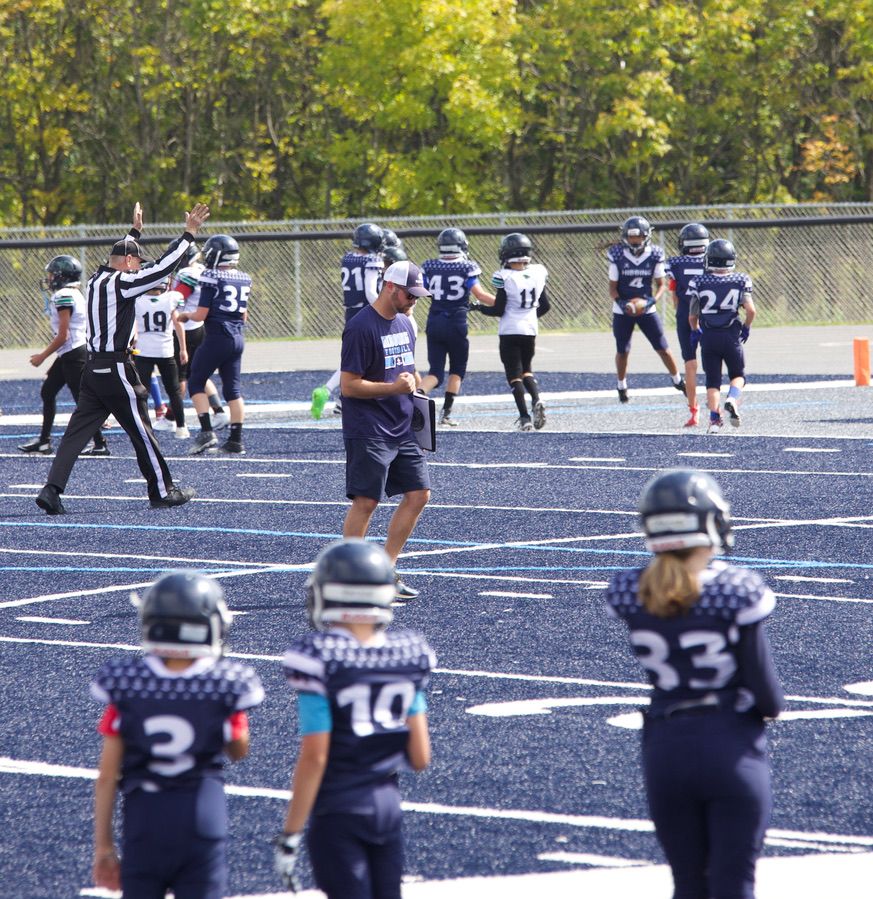 Northern Minnesota youth football action photography capturing fast-paced game moments