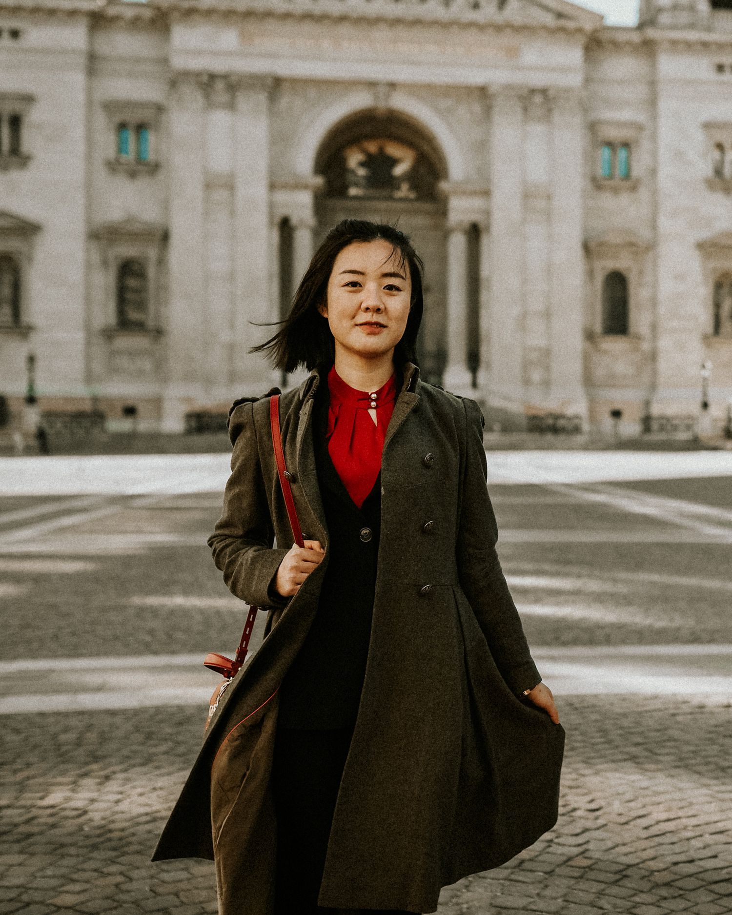 Young woman's portrait, while walking in front of St. Stephen's Basilica in Budapest