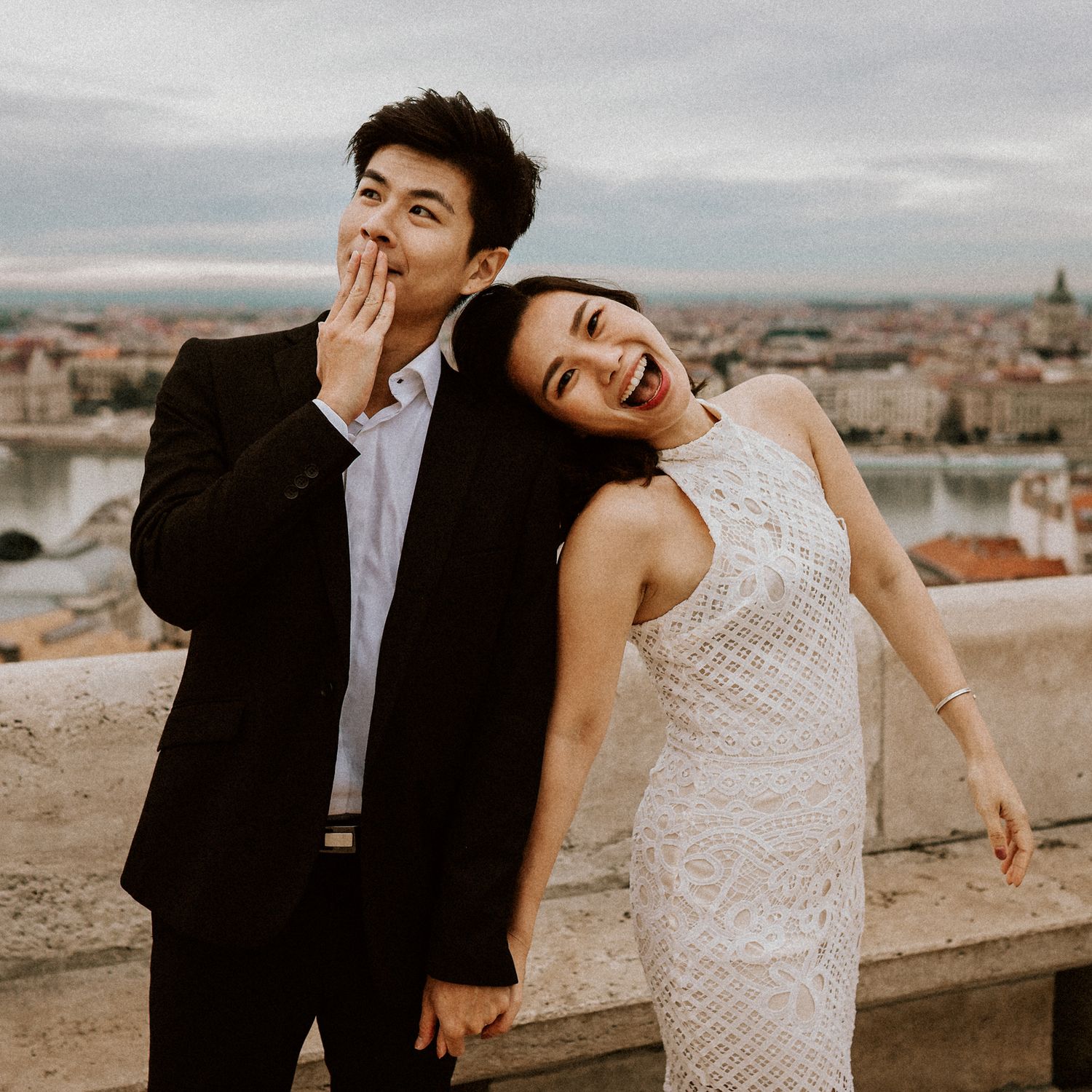 Asian couple posing and laughing during their pre-wedding photoshoot in Budapest