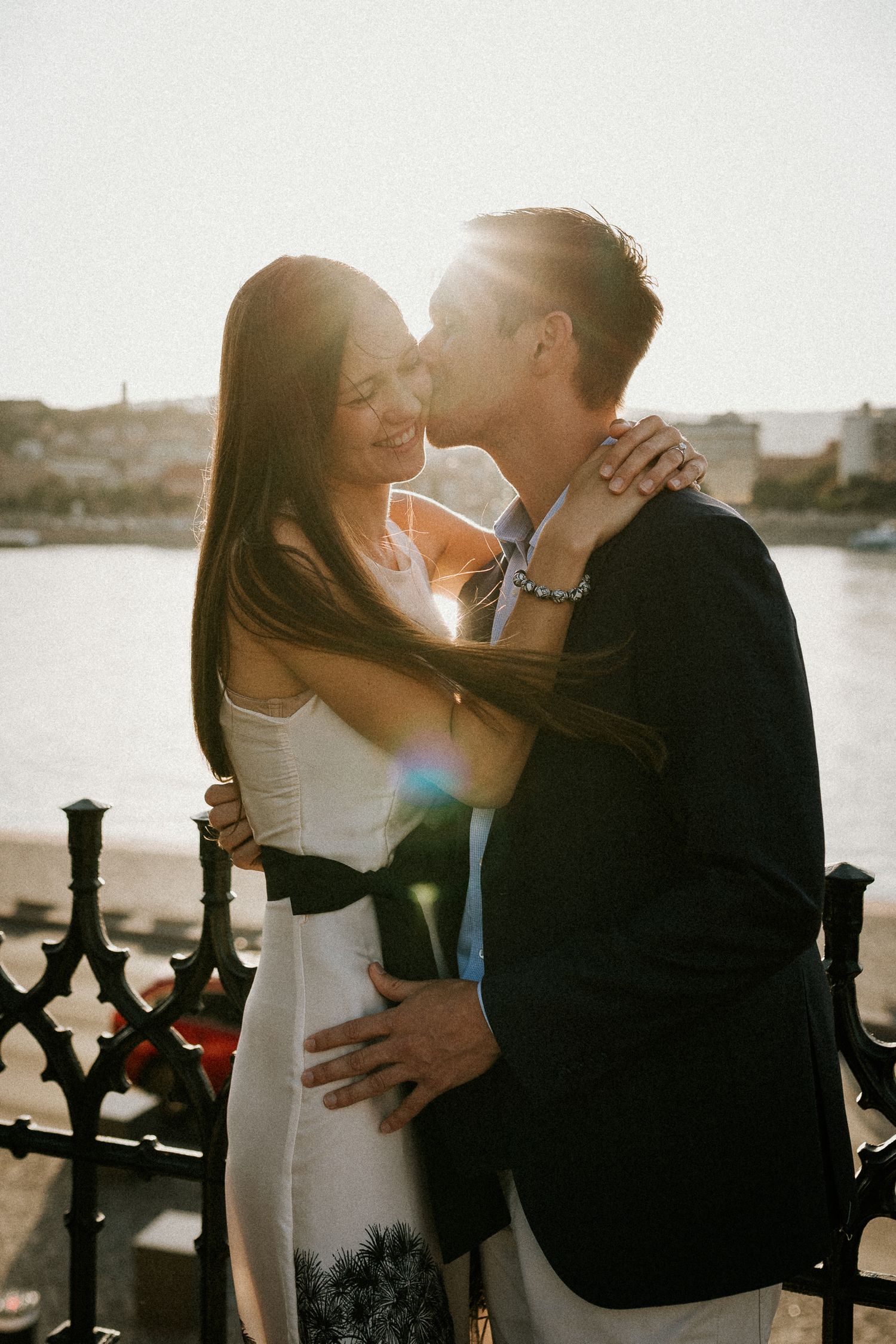 Lovebirds kissing in the sunset