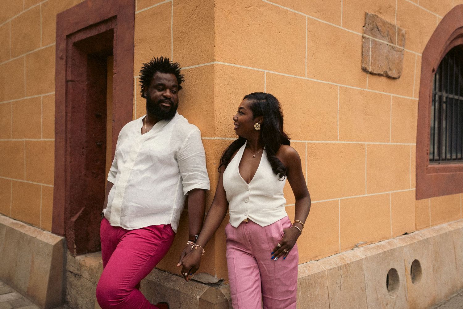 Candid portrait of a stylish couple taken by Budapest photographer András Grausz in the streets of the Buda Castle area.