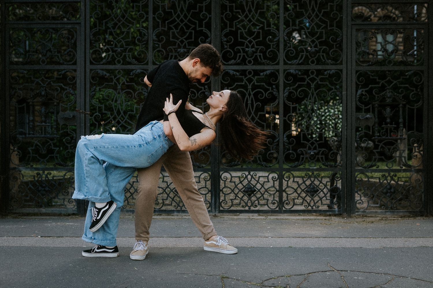Portrait of a young couple dancing on the street