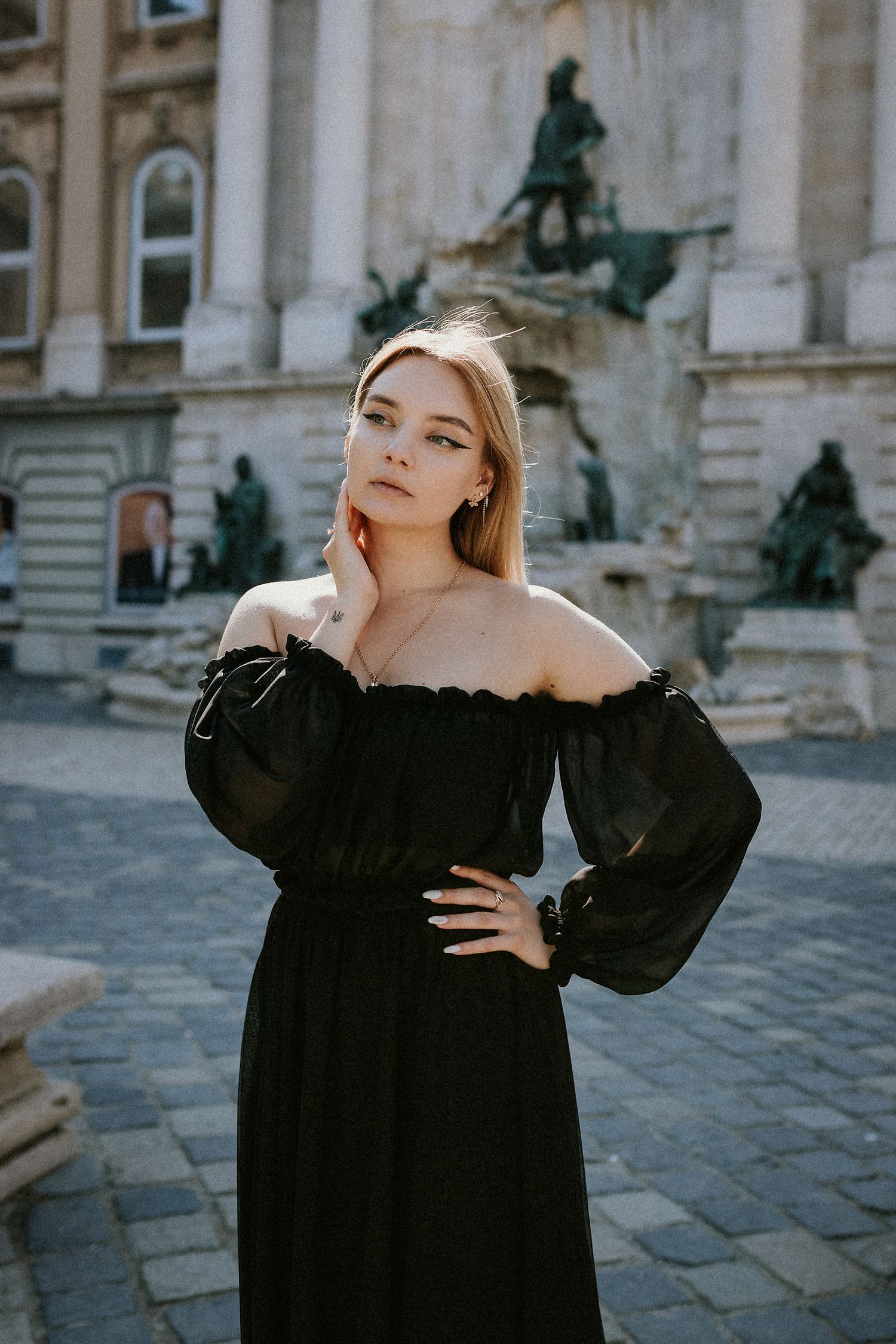 Young woman's portrait in front of Matthias Fountain at Buda Castle