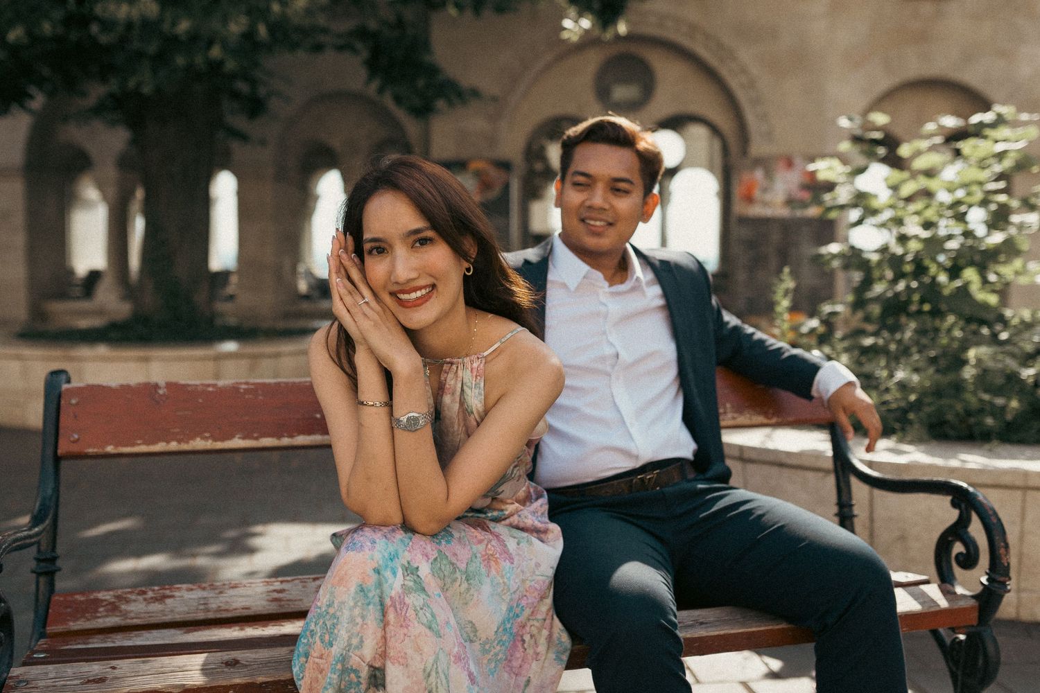 Asian couple sitting on a bench