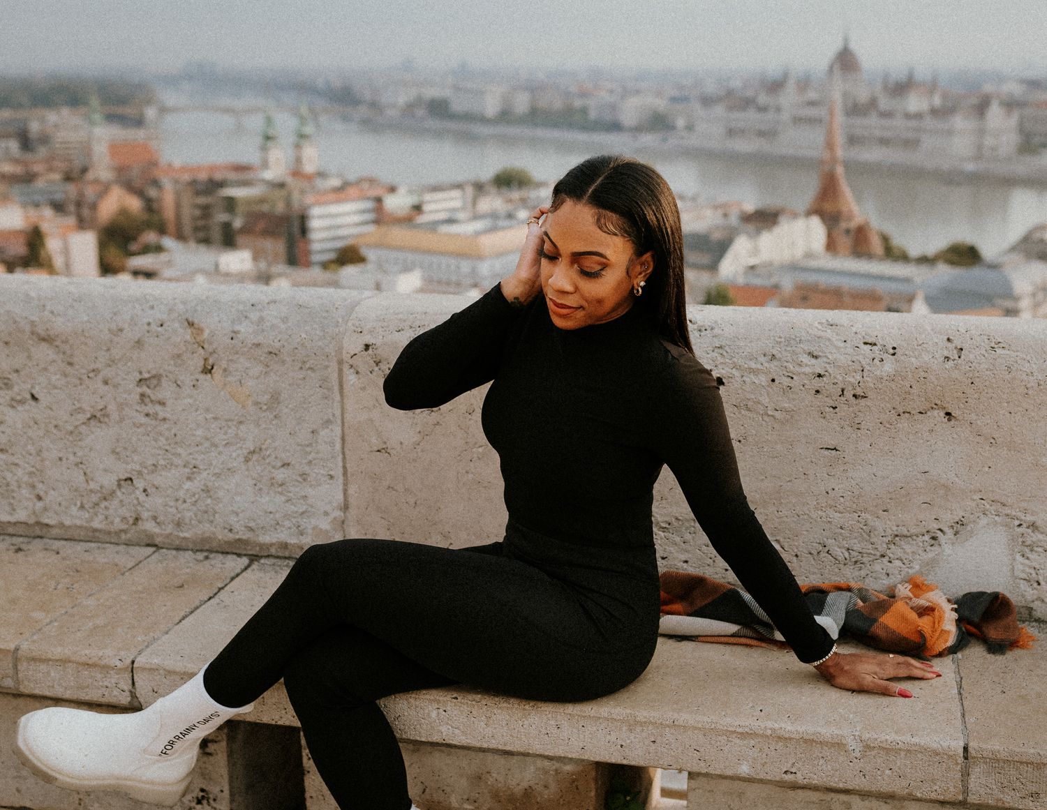 Woman sitting on a bench during her Budapest photo session
