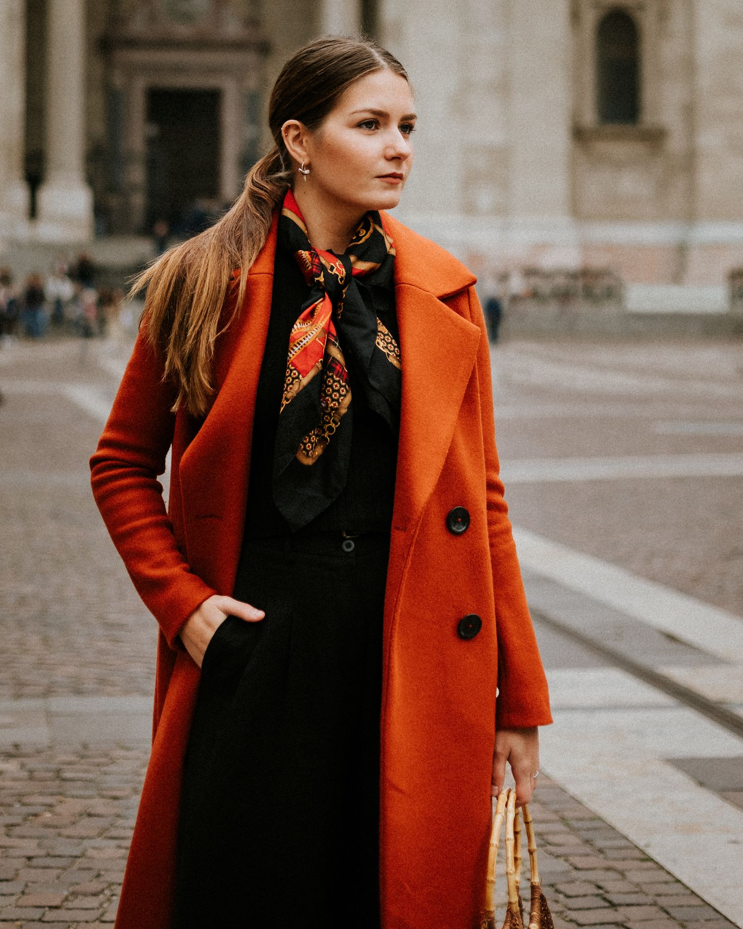 Elegant woman posing for her portraits in front of St. Stephen's Basilica in Budapest