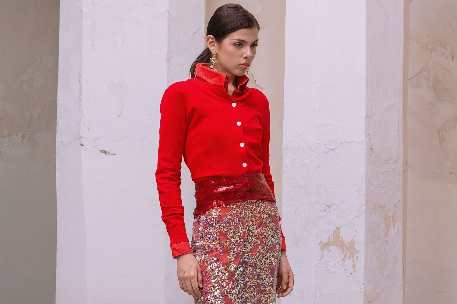 Woman wearing a dress shirt in a riad in the heart of medina of Marrakech during a fashion  photoshoot session.