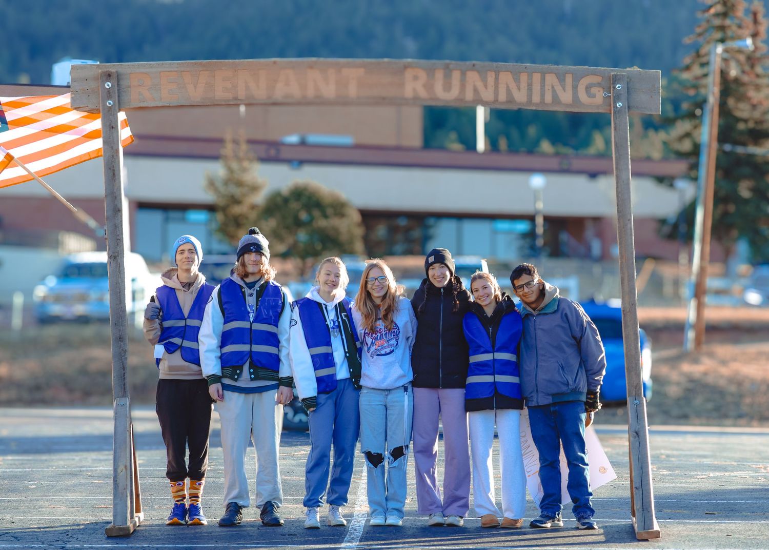 Group of volunteers after a race pose for a picture