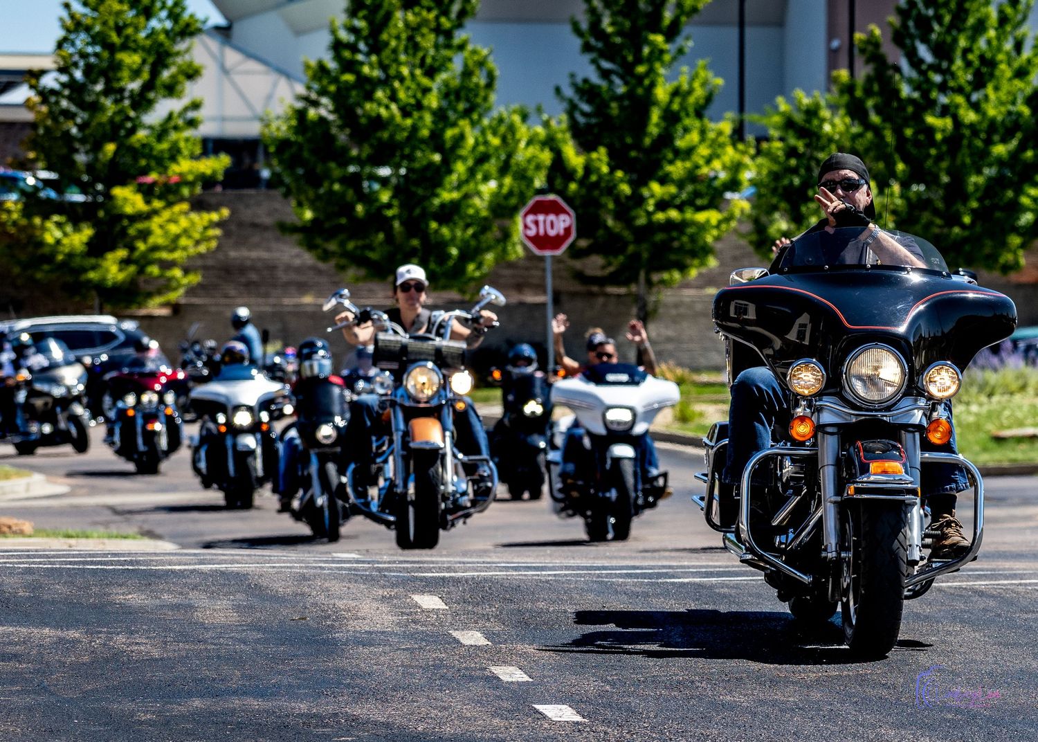 Biker rally ride entering a parking lot