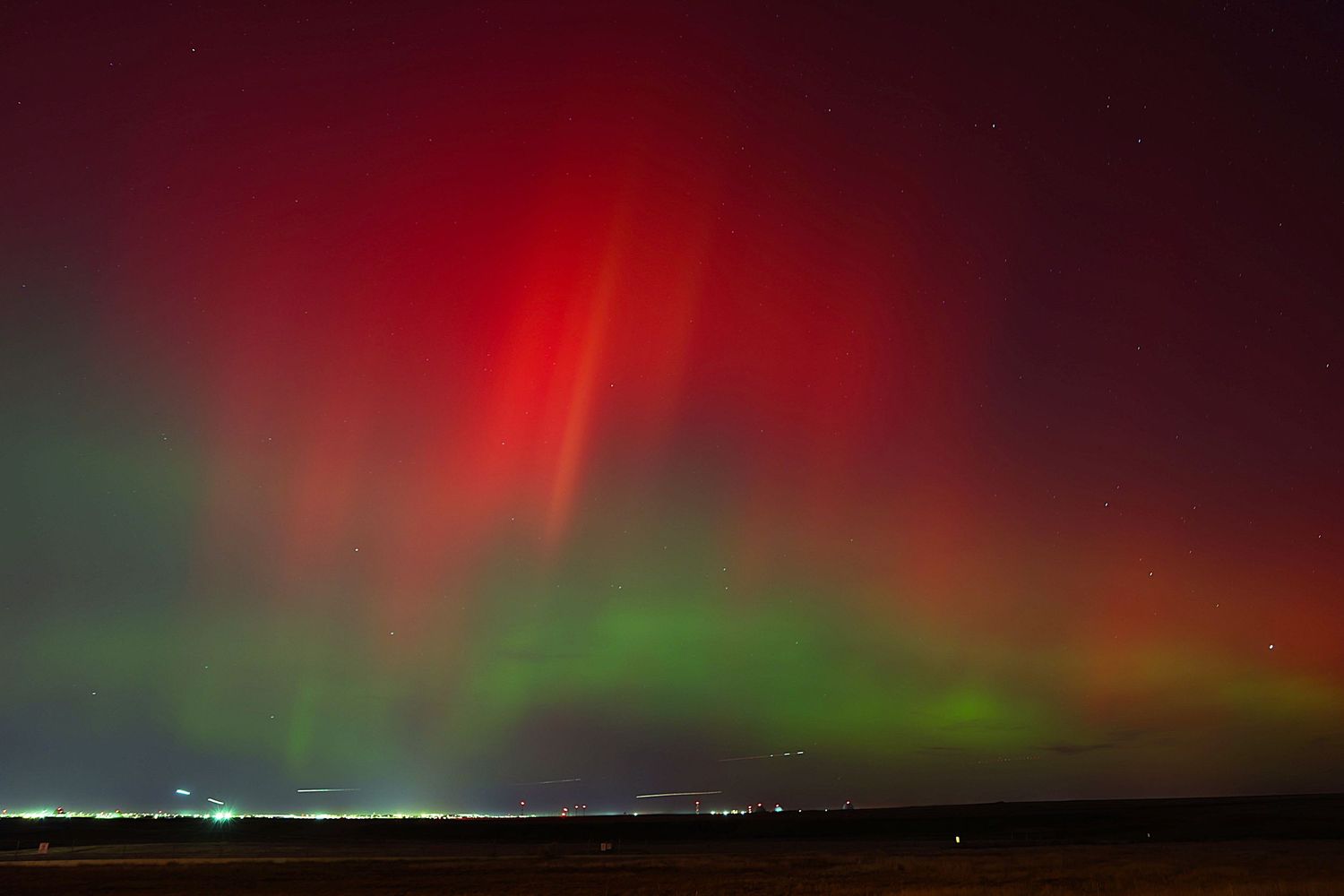 Green and red Aurora Borealis in the sky