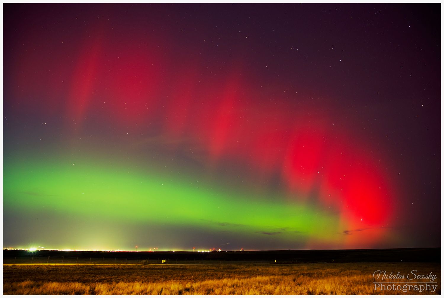 Green and red Aurora Borealis in the sky
