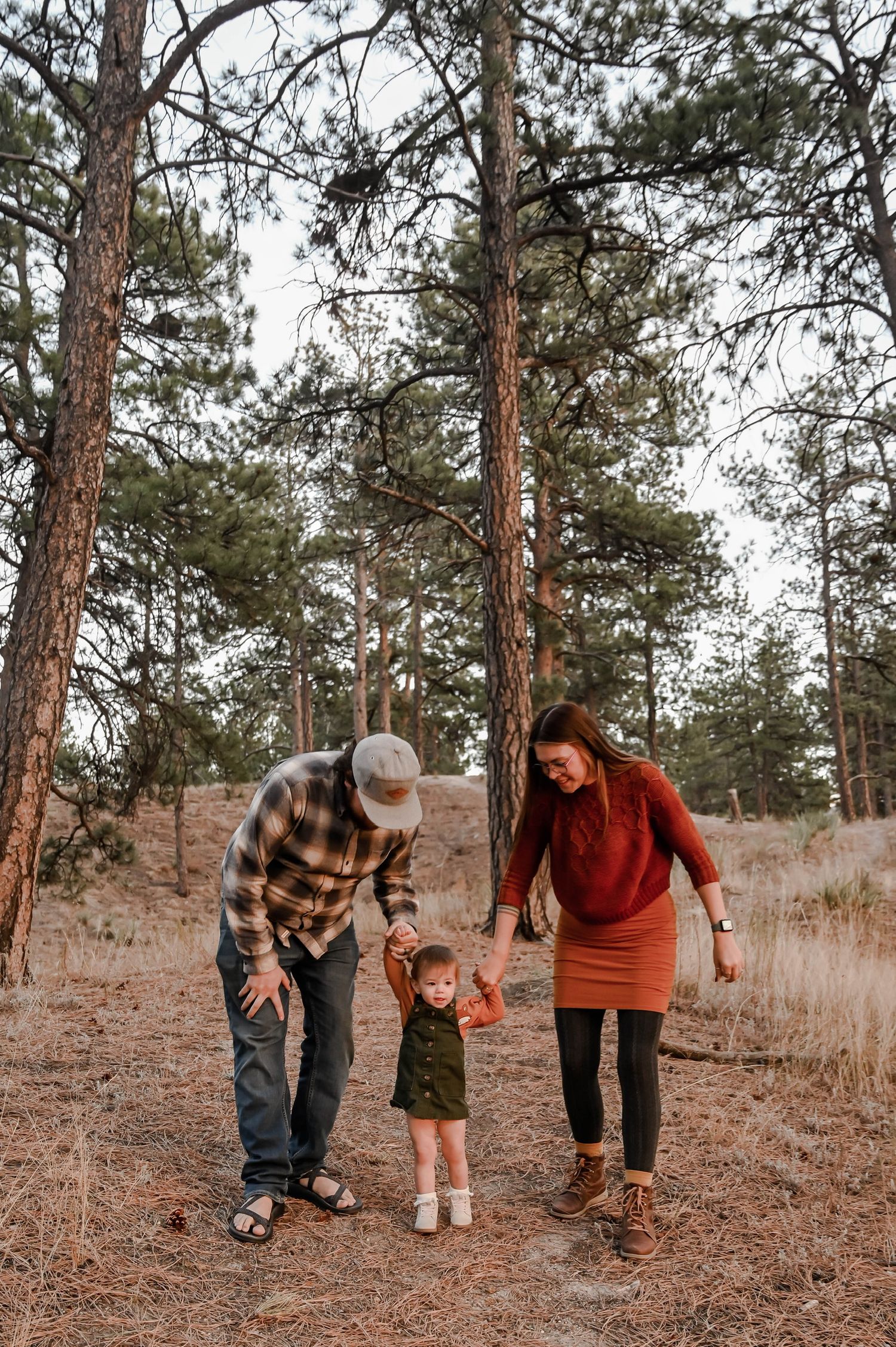 A new family walking together in the woods