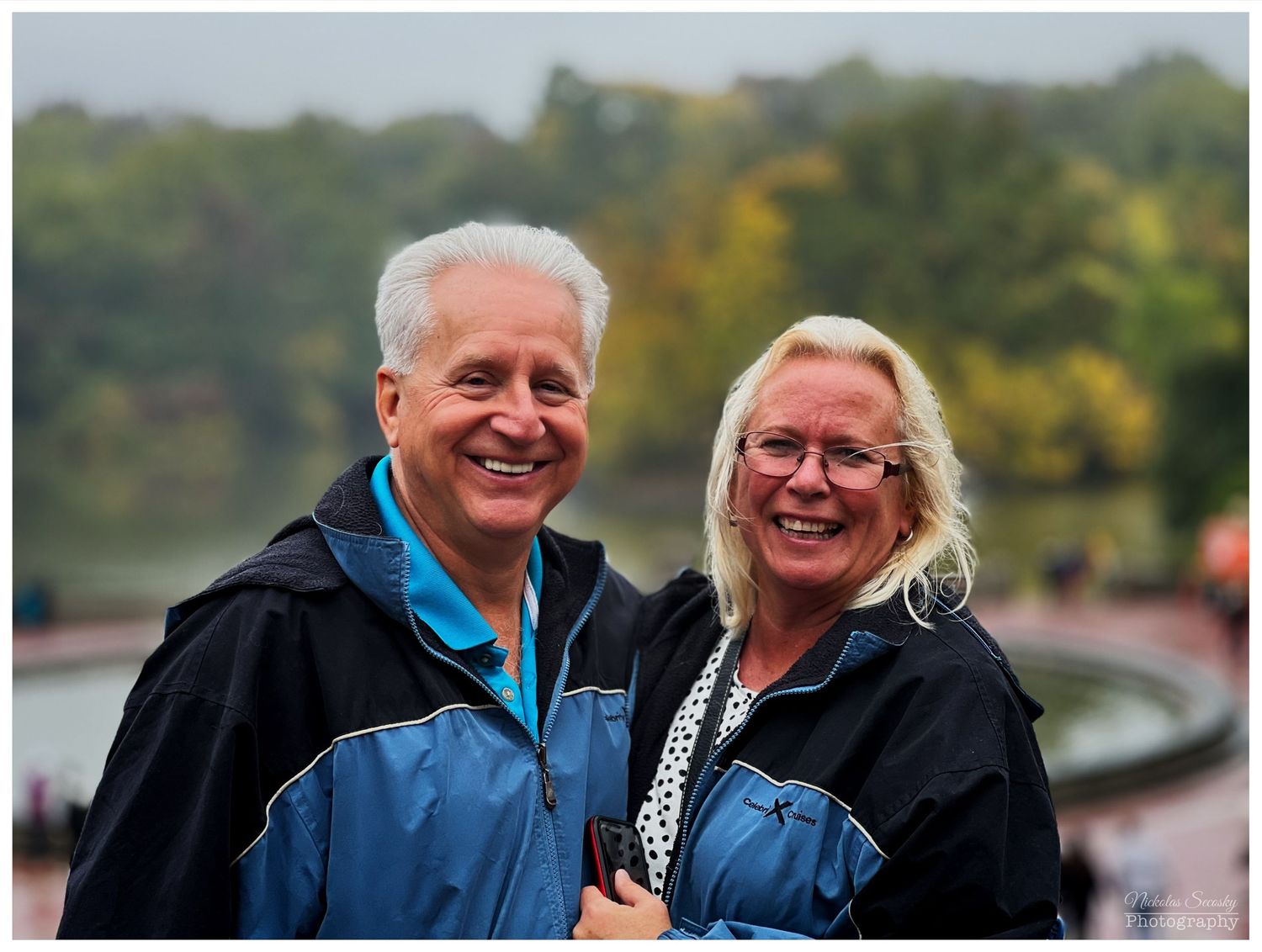 An older couple posing together in a park