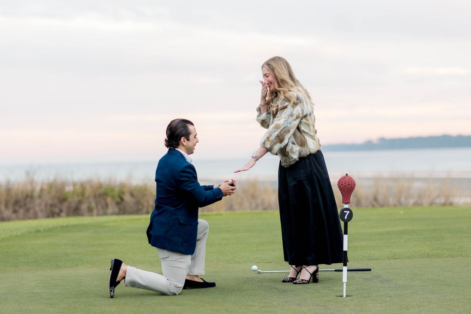 A romantic marriage proposal sequence shows a couple on a scenic golf course with ocean views in the background.