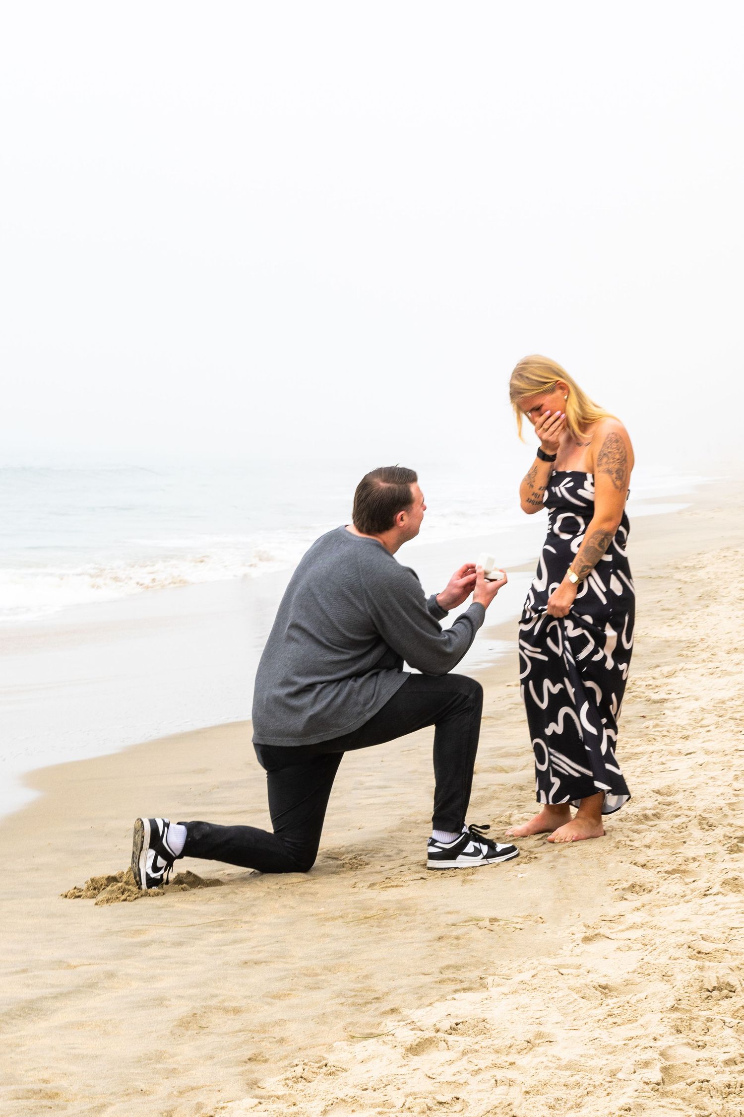 Surprise Proposal Photography at Huntington Beach in Orange County California by Photographer Tim Guerrero from Pasadena