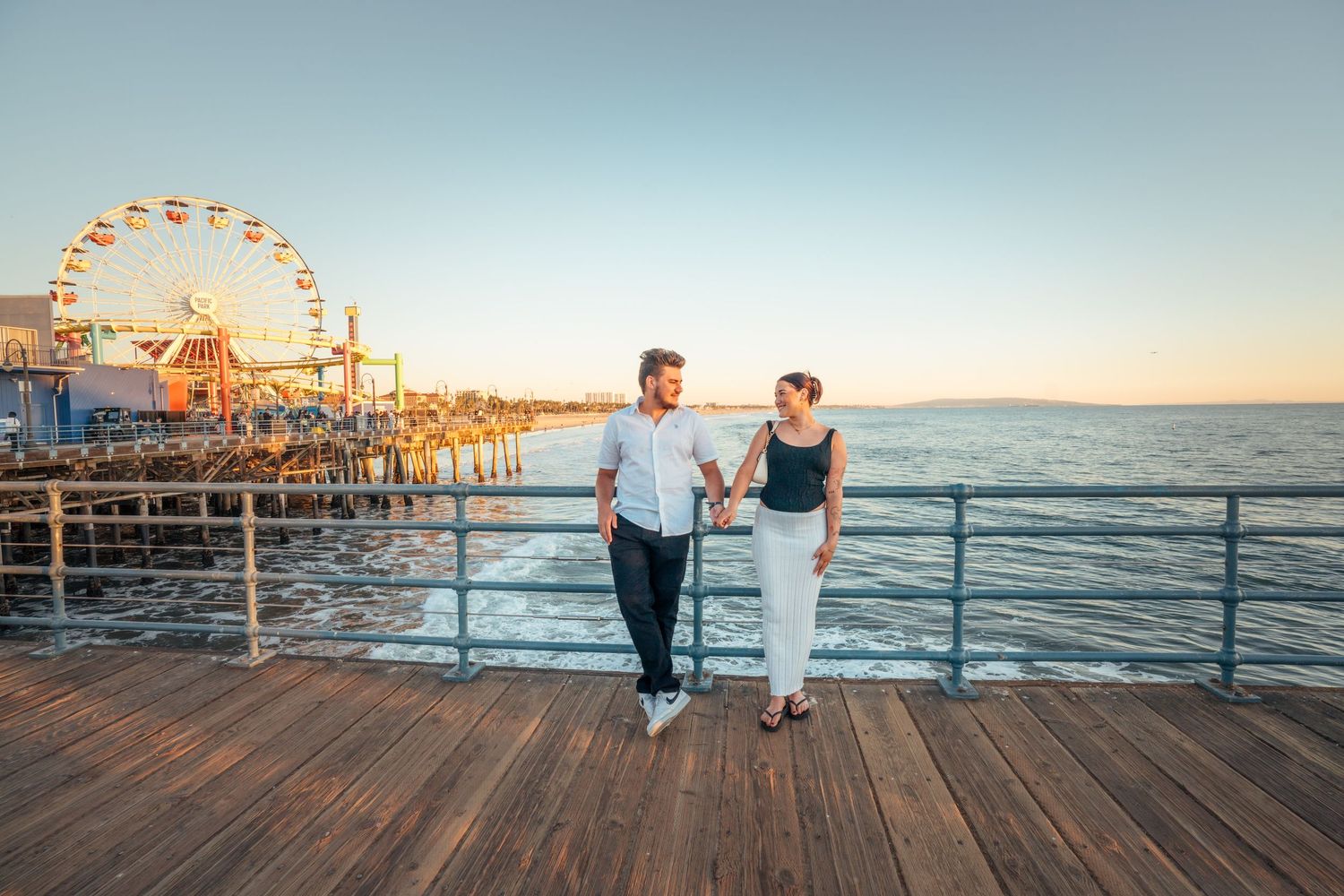 Surprise Proposal Photography at Santa Monica Pier in Santa Monica California by Photographer Tim Guerrero
