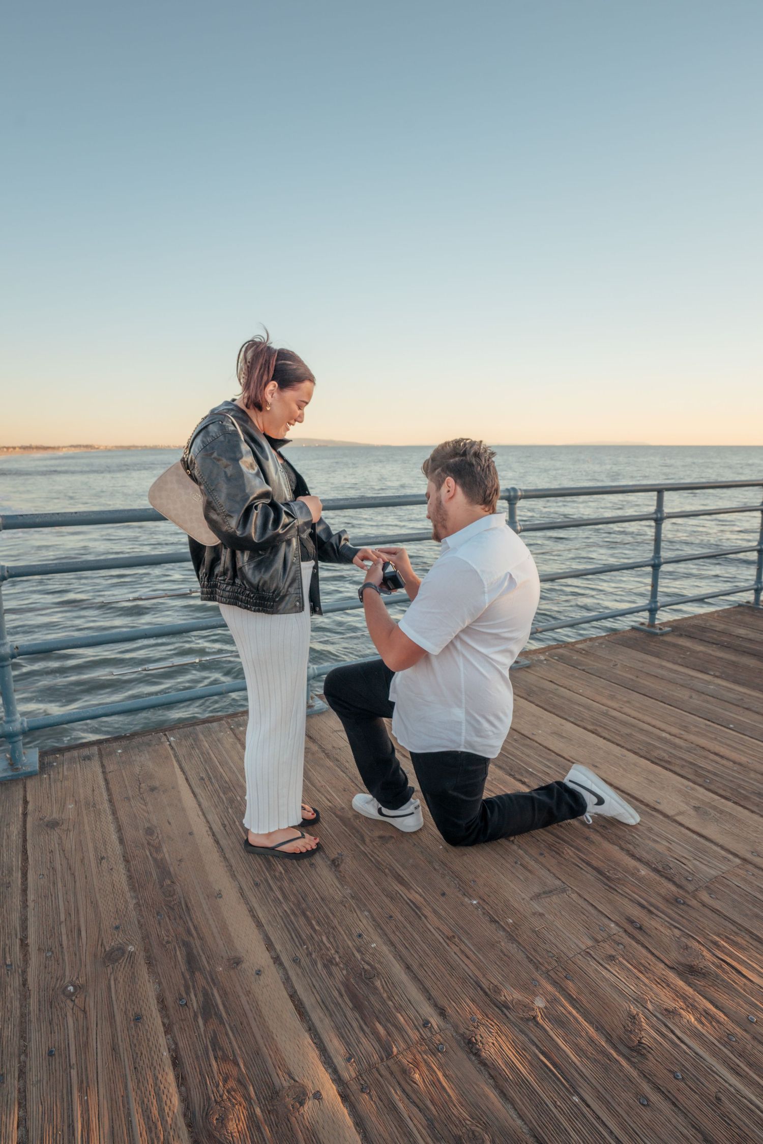 Surprise Proposal Photography at Santa Monica Pier in Santa Monica California by Photographer Tim Guerrero from Pasadena