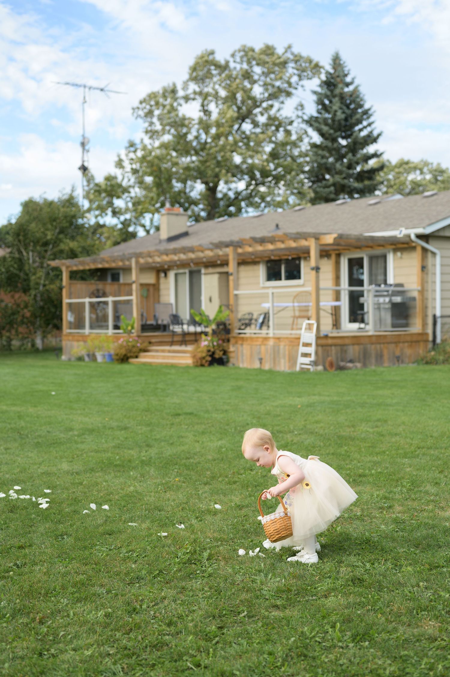 A sequence of photos showing a ranch-style house with wooden deck and pergola in a spacious outdoor ceremony space with the flower girl.