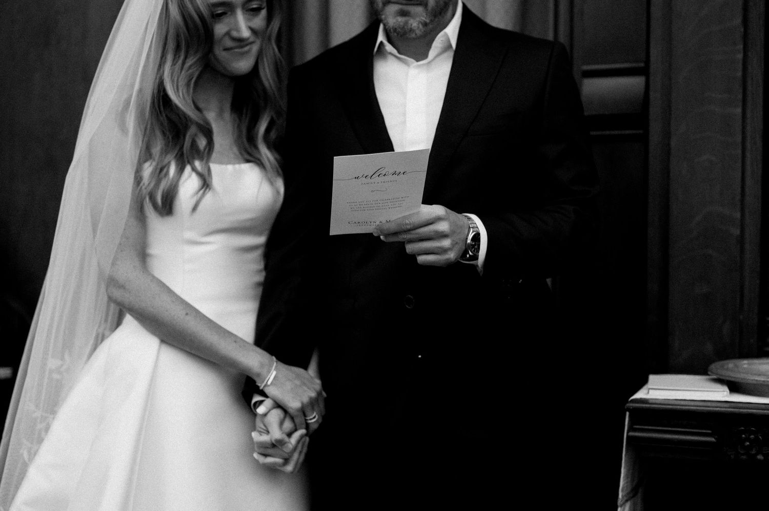 Black and white wedding photography collage showing intimate moments between a bride and groom during their ceremony.