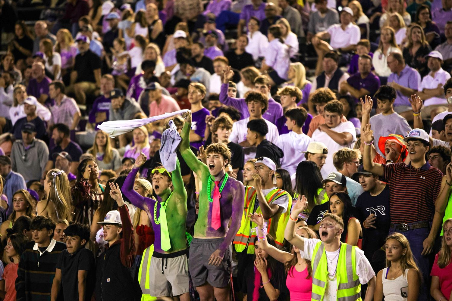 R.L. Paschal High School students cheer on the team at the Homecoming game as the Varsity Football team had just scored a touchdown.