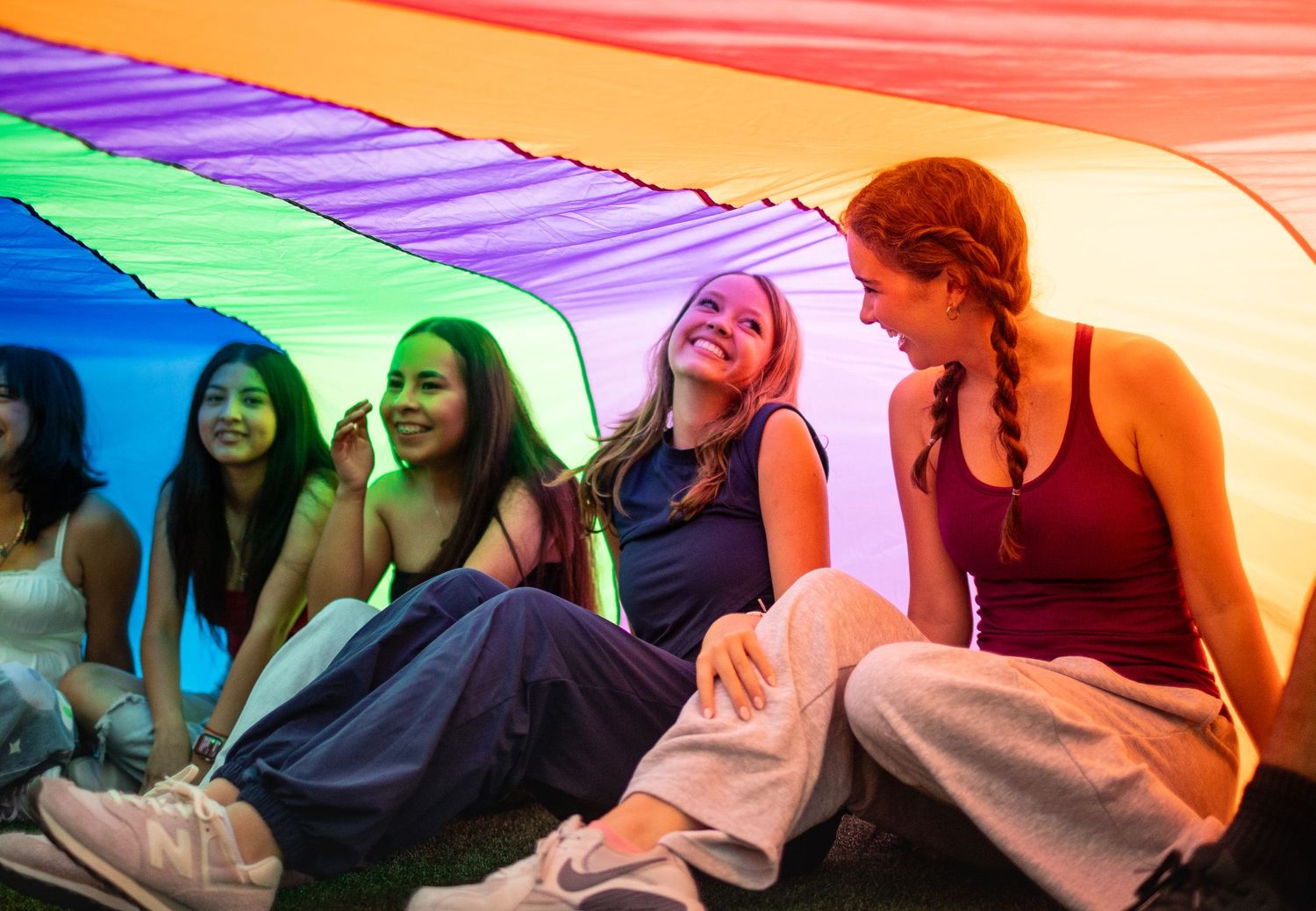R.L. Paschal High School student participates in the school's annual Senior Sunrise by smiling big under a parachute.