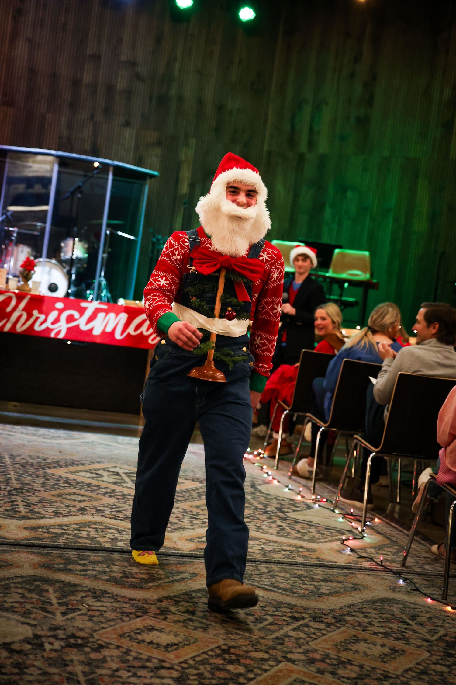 R.L. Paschal High School student performs in Paschal YoungLife's annual Mr. Christmas Tree Pageant with a tree taped to his chest.