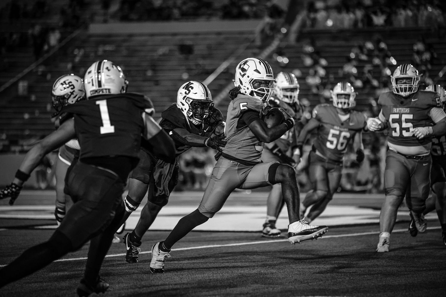 R.L. Paschal High School quarterback destroying the defense of Northside High at historic Farrington Field in Fort Worth, Texas.