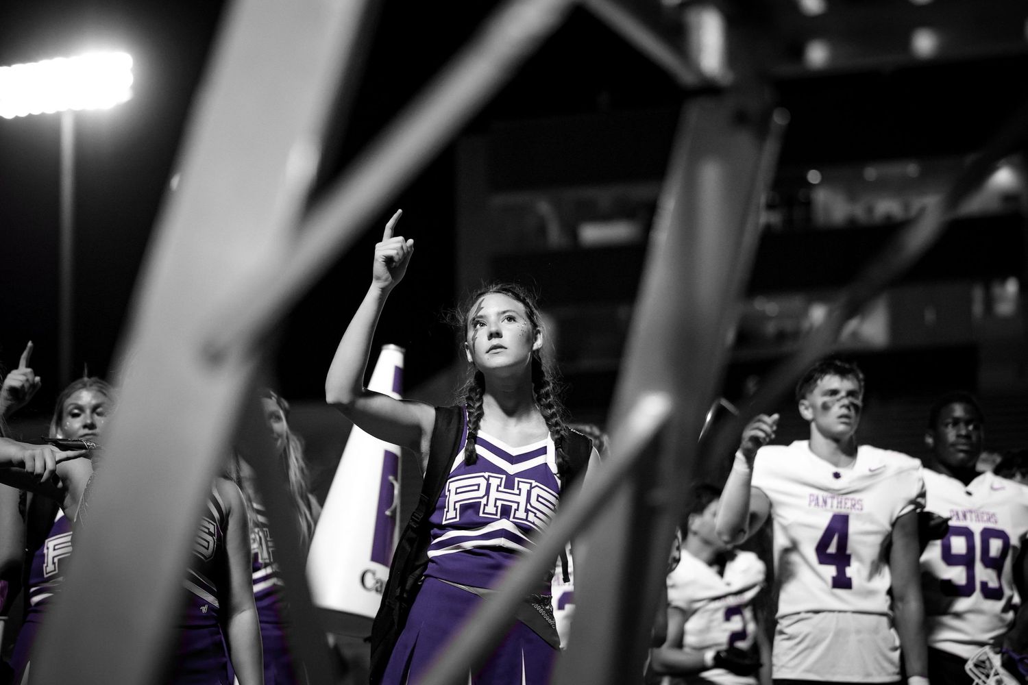 R.L. Paschal High School cheerleader sings along to the school's historic Alma Mater after a loss against Chisholm Trail High School.