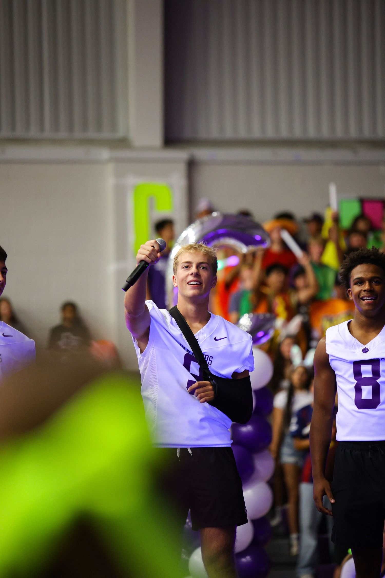 R.L. Paschal High School Varsity Football captain yells at the crowd to get the pep rally attendees ready for their homecoming game.