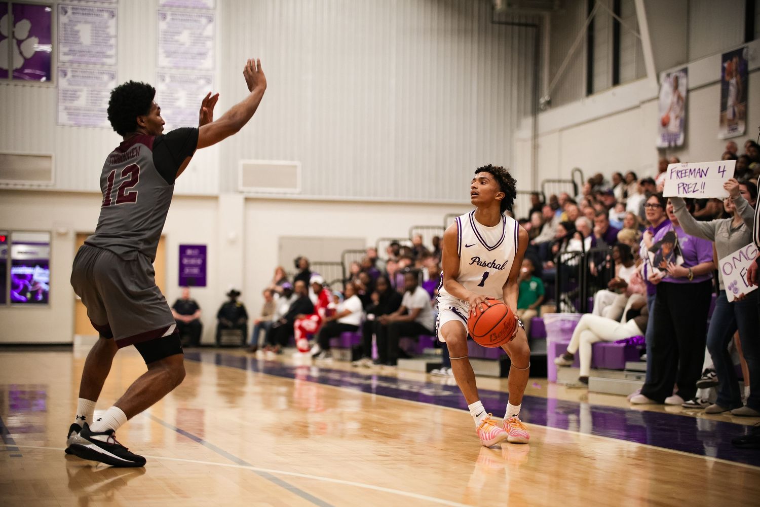 R.L. Paschal High School Varsity Basketball player prepares to shoot at the team's first Playoff game in the Gus Bates Center in Fort Worth.