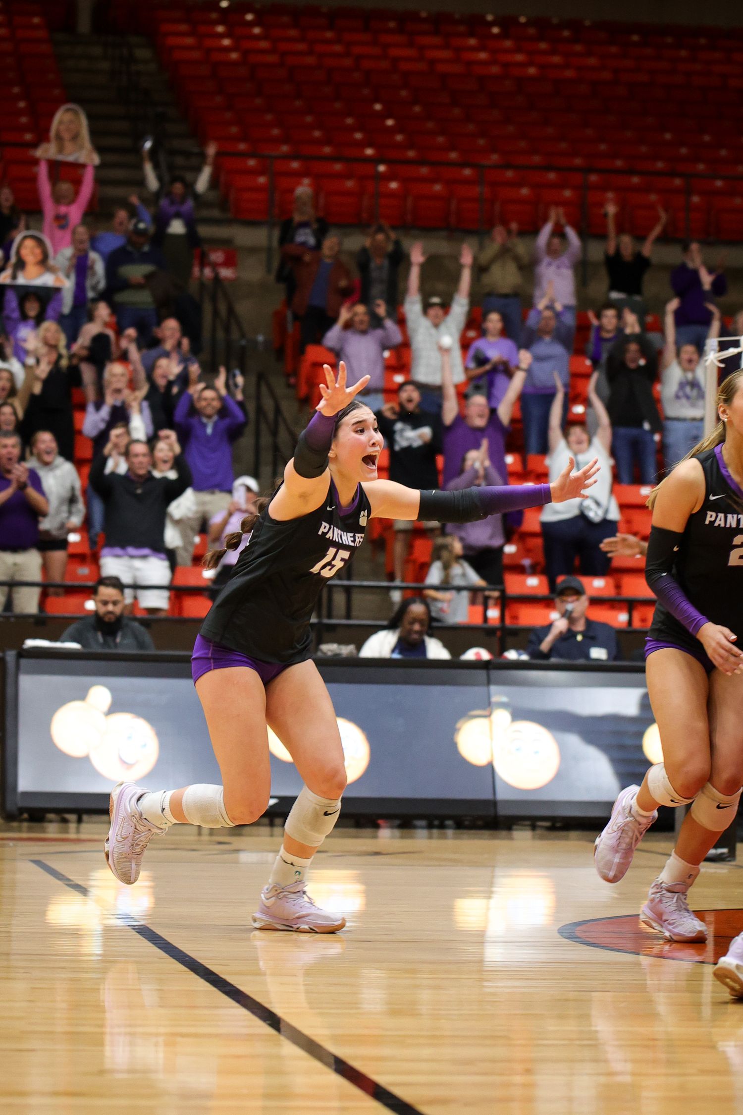 R.L. Paschal High School team celebrates on the court after becoming Bi-District Champions. The Varsity Volleyball team in Fort Worth, Texas