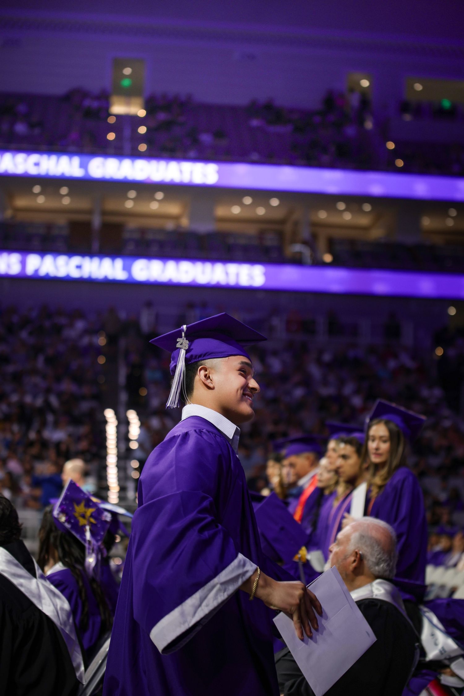 R.L. Paschal High School student shows his excitement after graduating as a part of the Class of 2026 in Dickies Arena in Fort Worth, Texas.