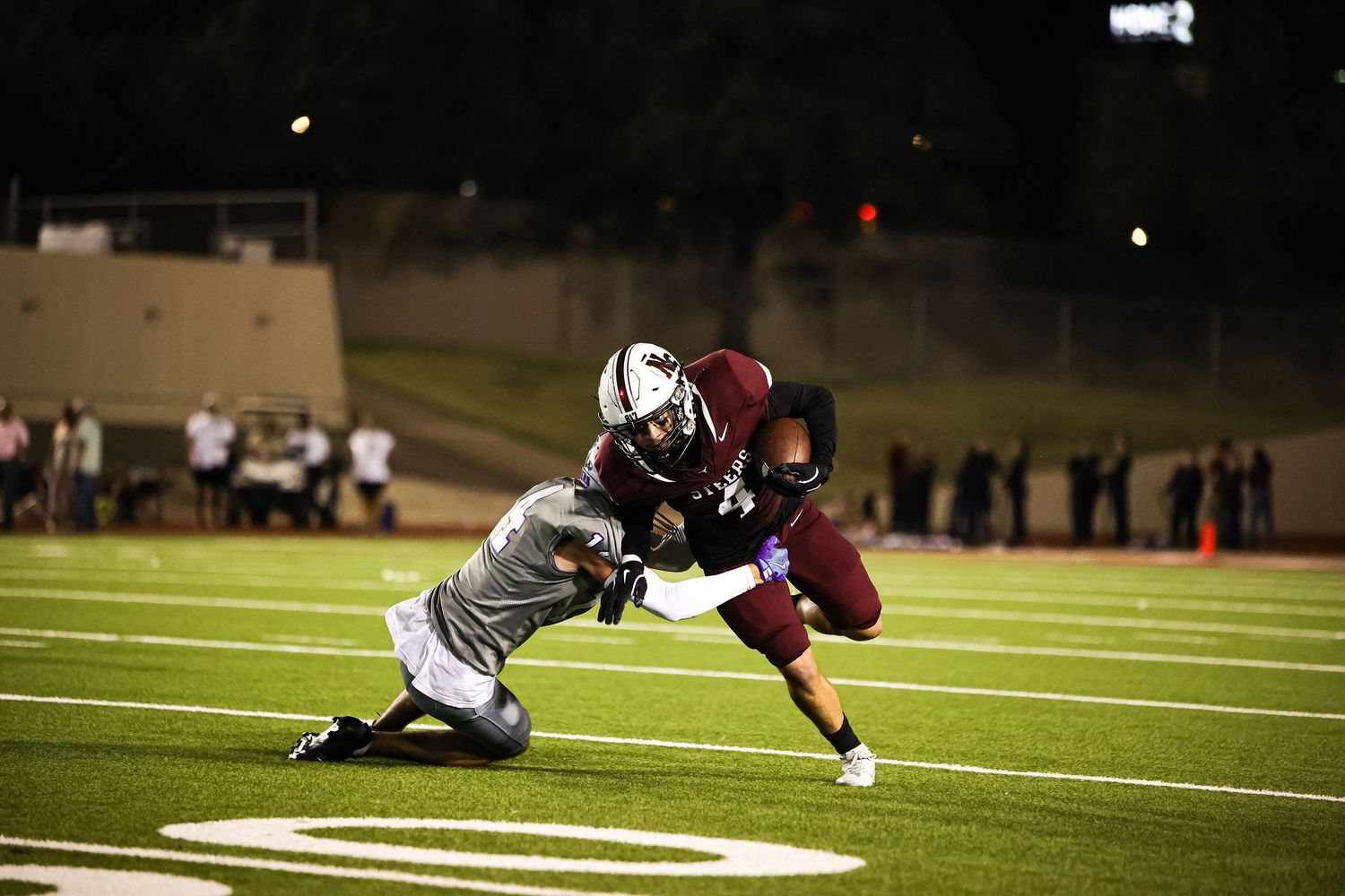 R.L. Paschal High School Varsity Football player tackles a Northside Football Player.