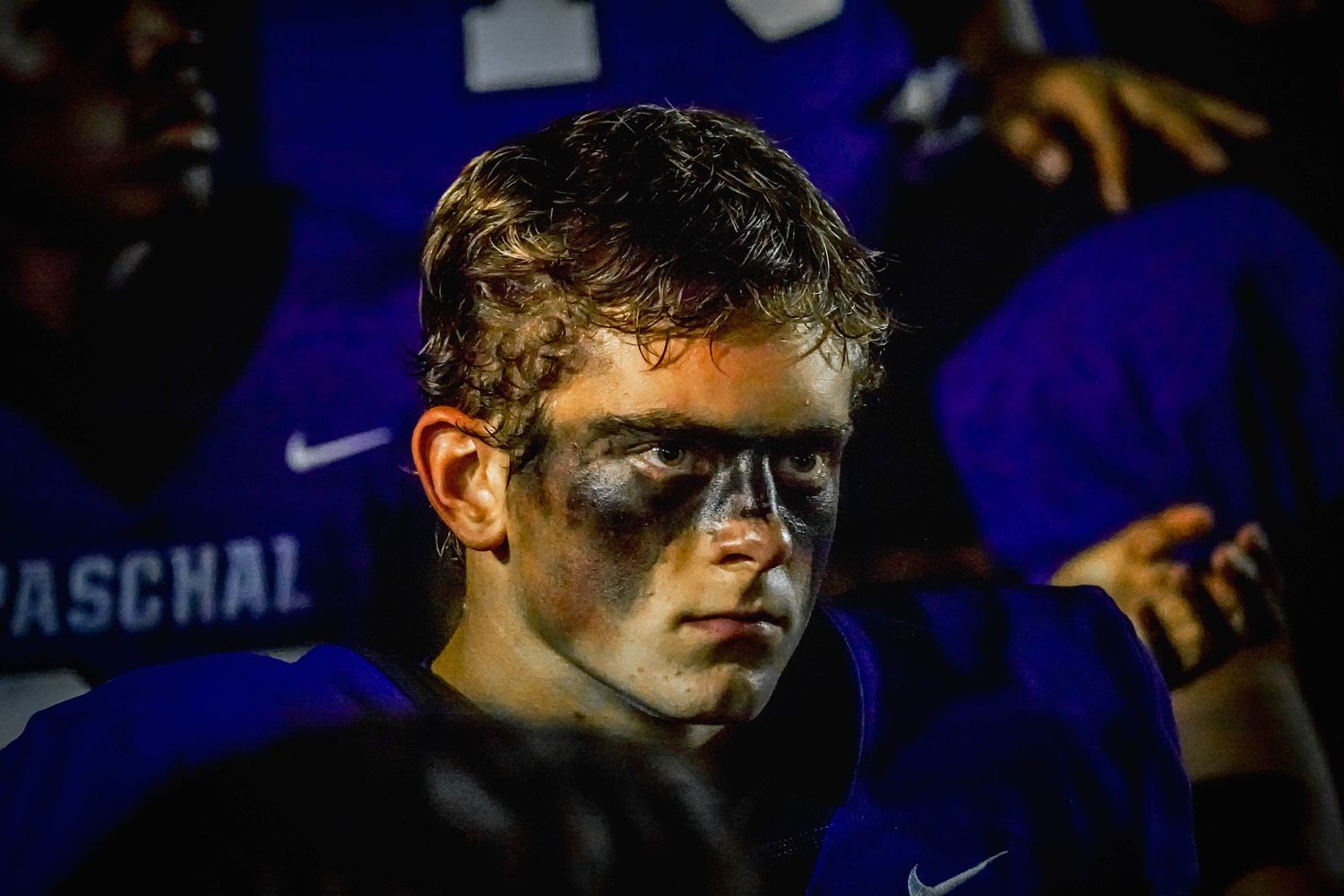 R.L. Paschal High School football player listens to his coach during the intense Arlignton Heights Battle of The Bonfire at Farrington Field