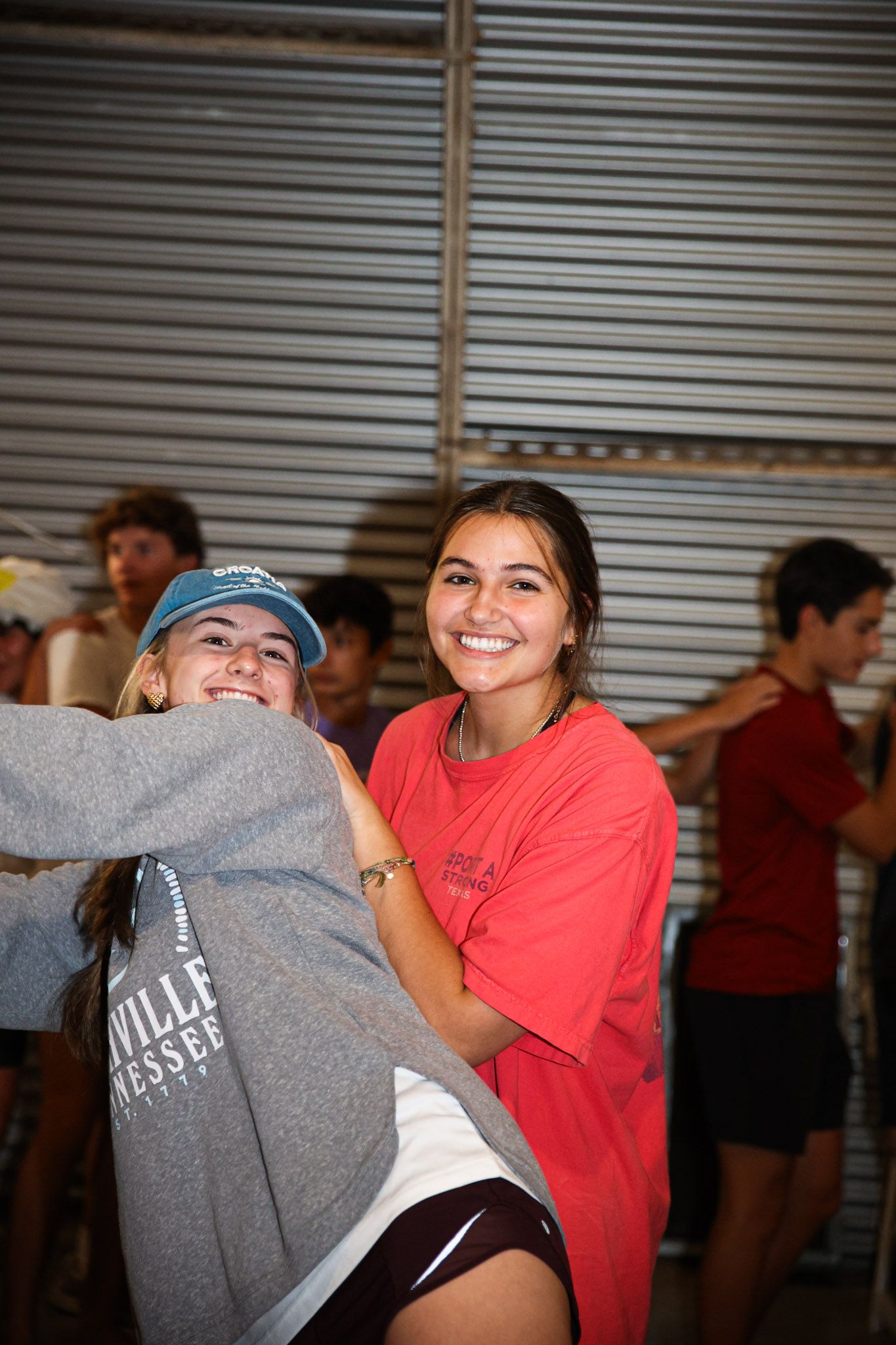 R.L. Paschal High School students pose for a photo at a Paschal YoungLife club in The Vintage Rail as they laugh while playing a game.
