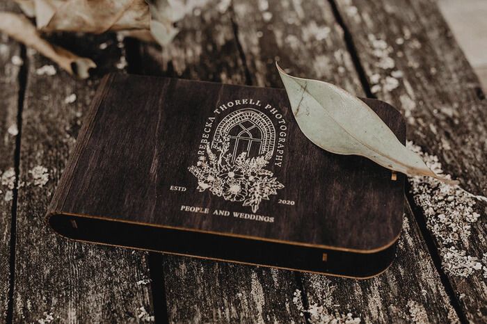 A collection of rustic wedding rings displayed on weathered wood surfaces with natural textures and vintage details.