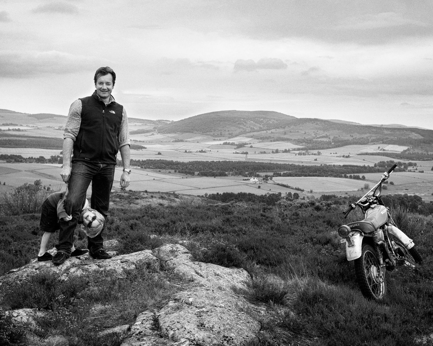 Black and white landscape photos of a motorcyclist on rugged terrain with hills in the background Aberdeenshire, Scotland.