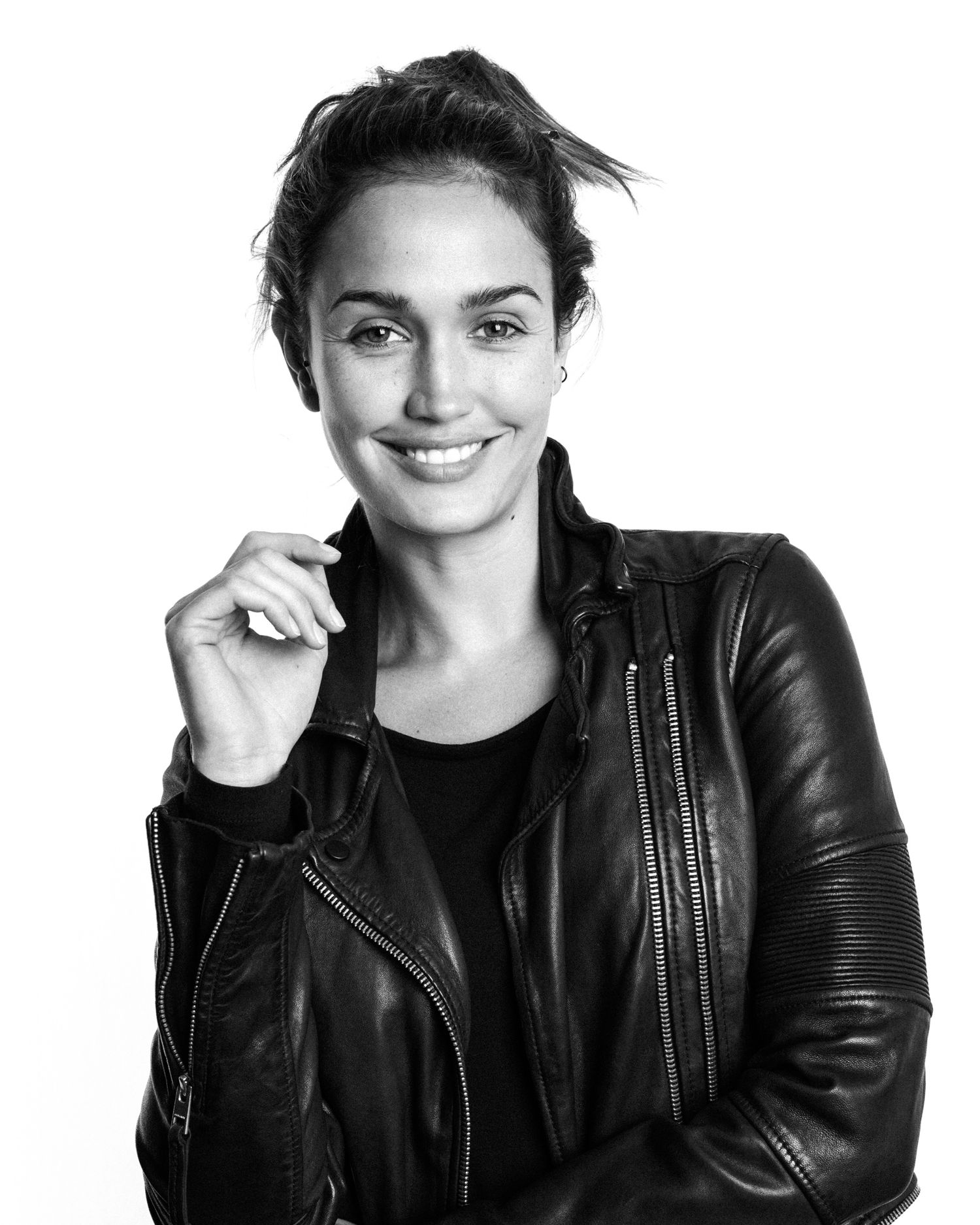 Black and white portrait series showing expressive poses in leather jacket.