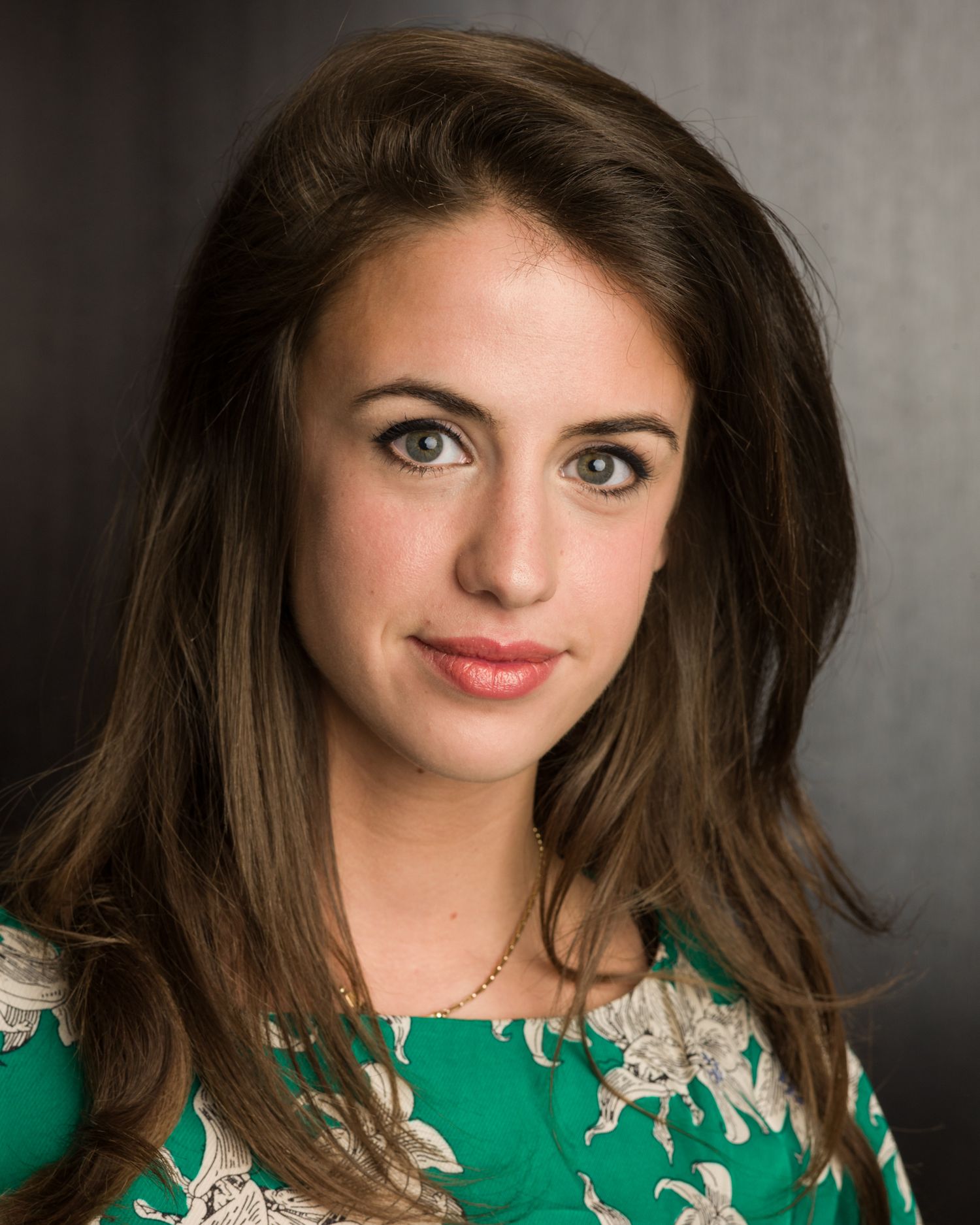 Business headshot Portrait sequence of female wearing an emerald green dress with lace detail.