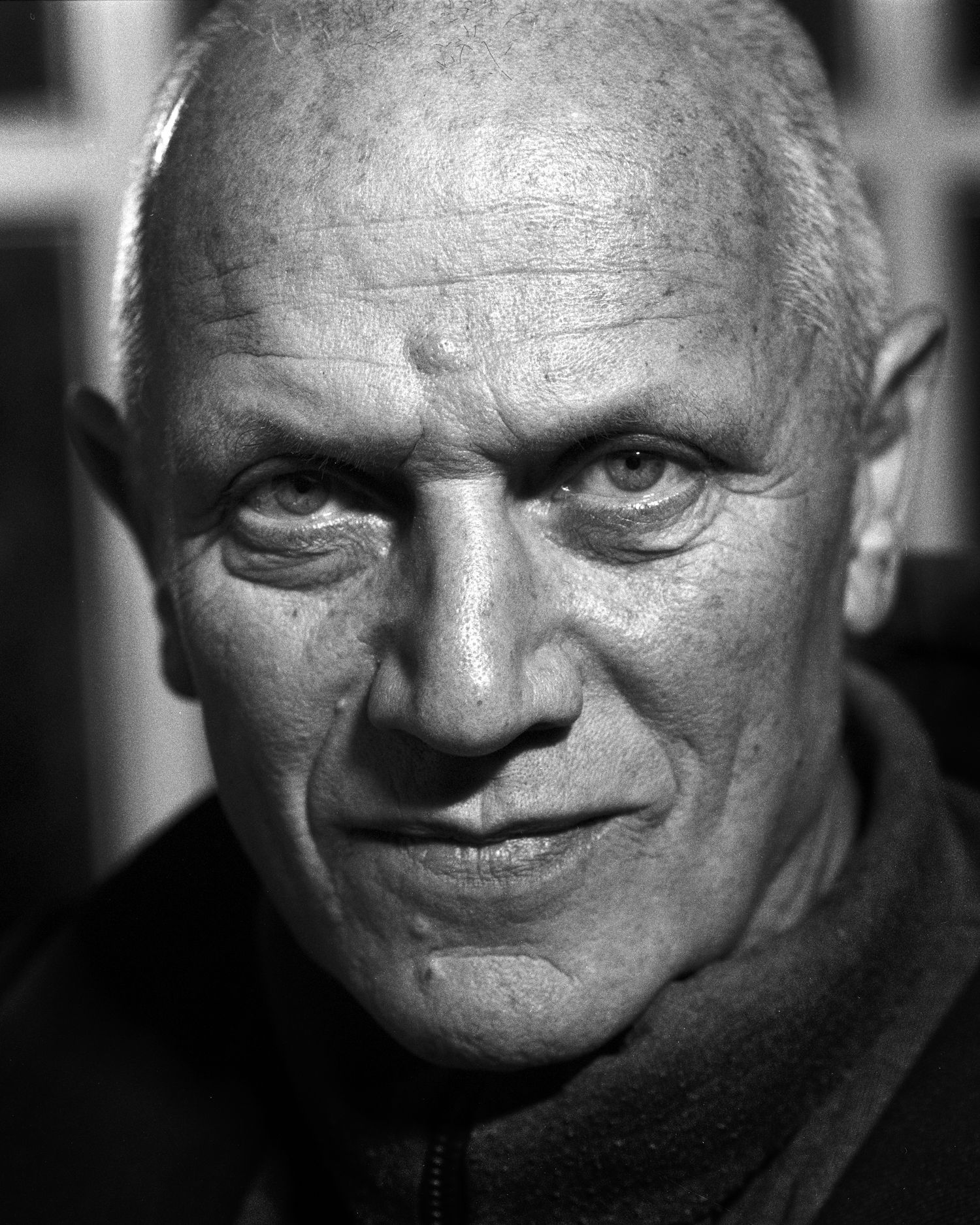 Close-up analogue Hasselblad black and white portrait series of Steven Berkoff showing intense facial expressions.
