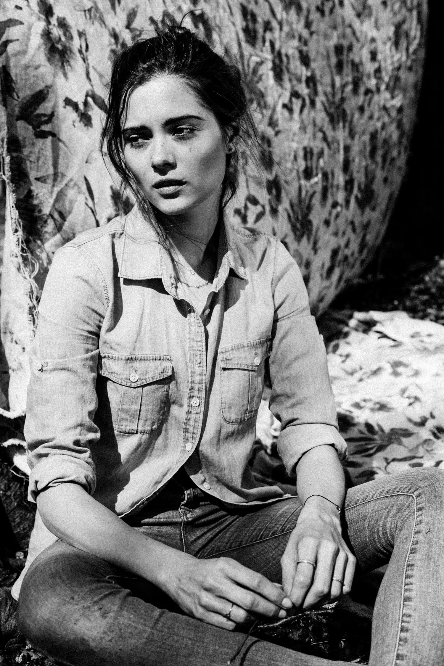 Black and white portrait series showing model Thea  in denim clothing against a textured background.