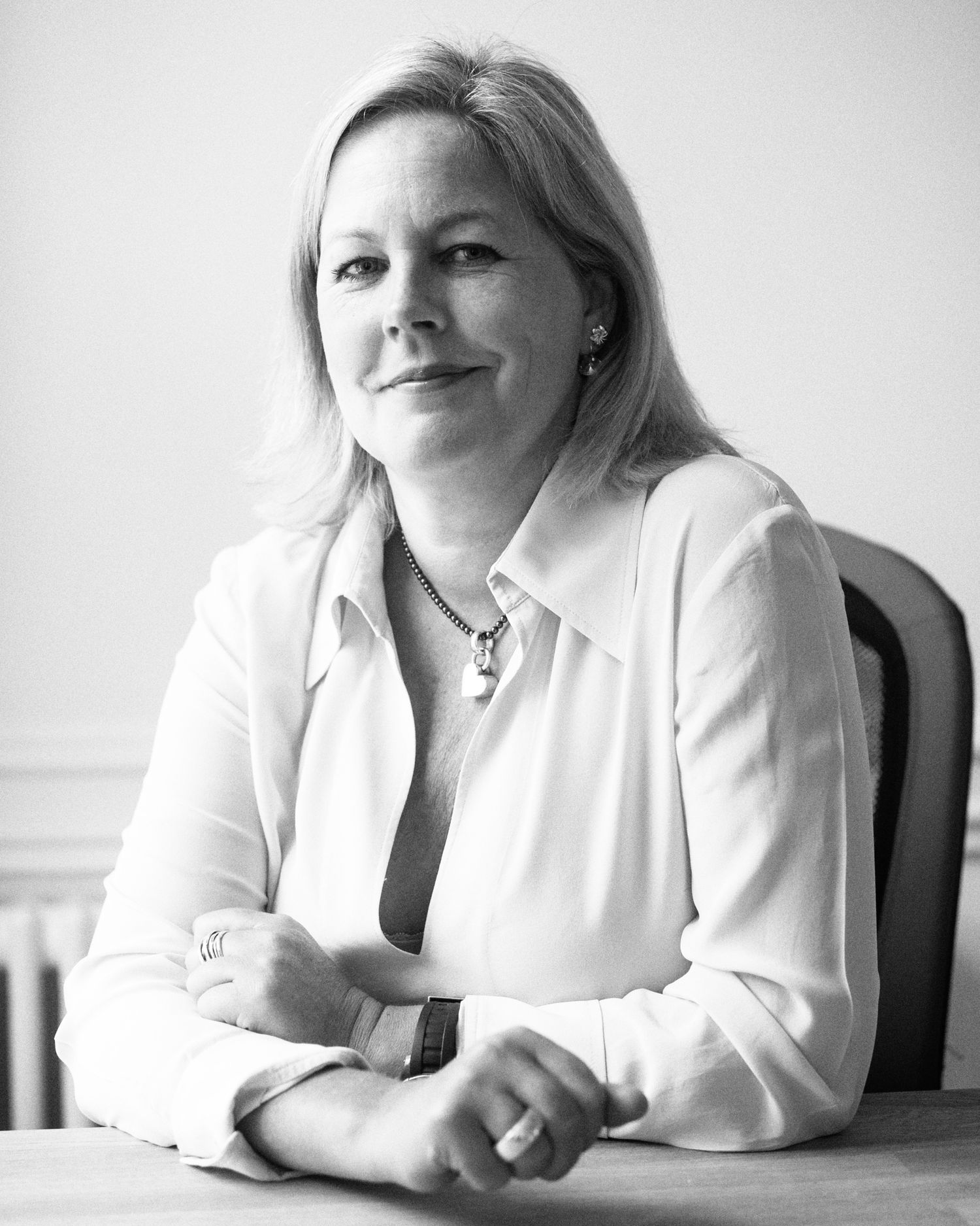 Series of casual portraits showing woman in white shirt against light background.