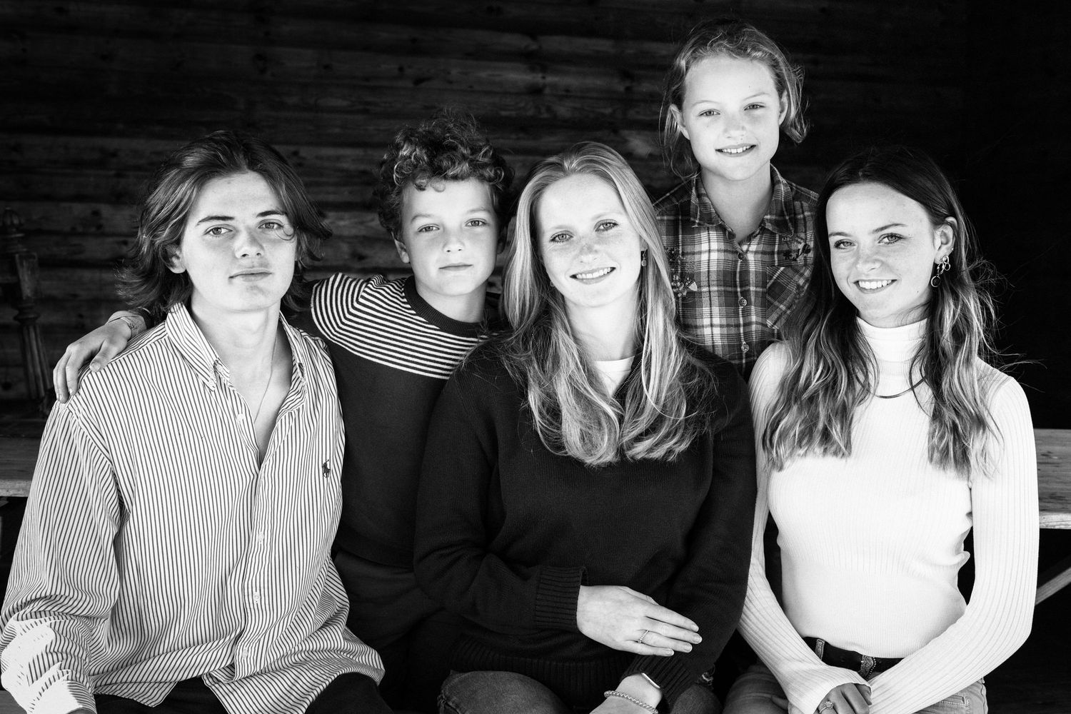 Black and white portraits showing casual family moments in a natural setting.