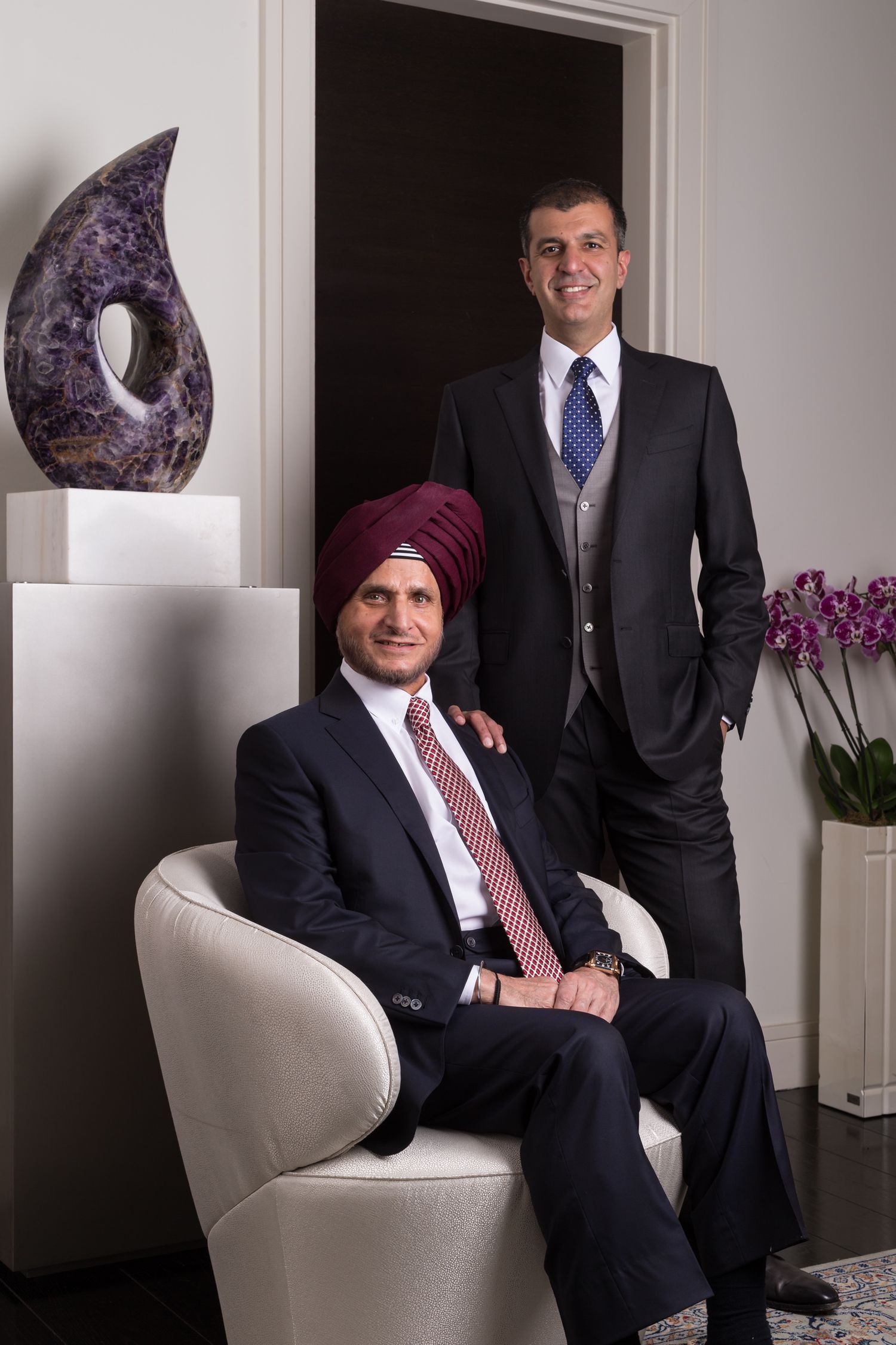 Professional corporate portraits in an elegant office setting with modern decor.