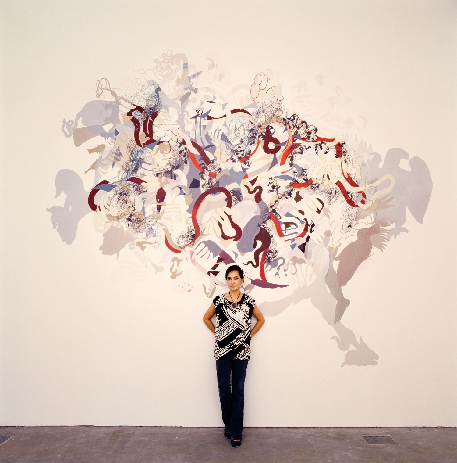 Abstract art sequence showing red and gray fluid shapes flowing across multiple panels.