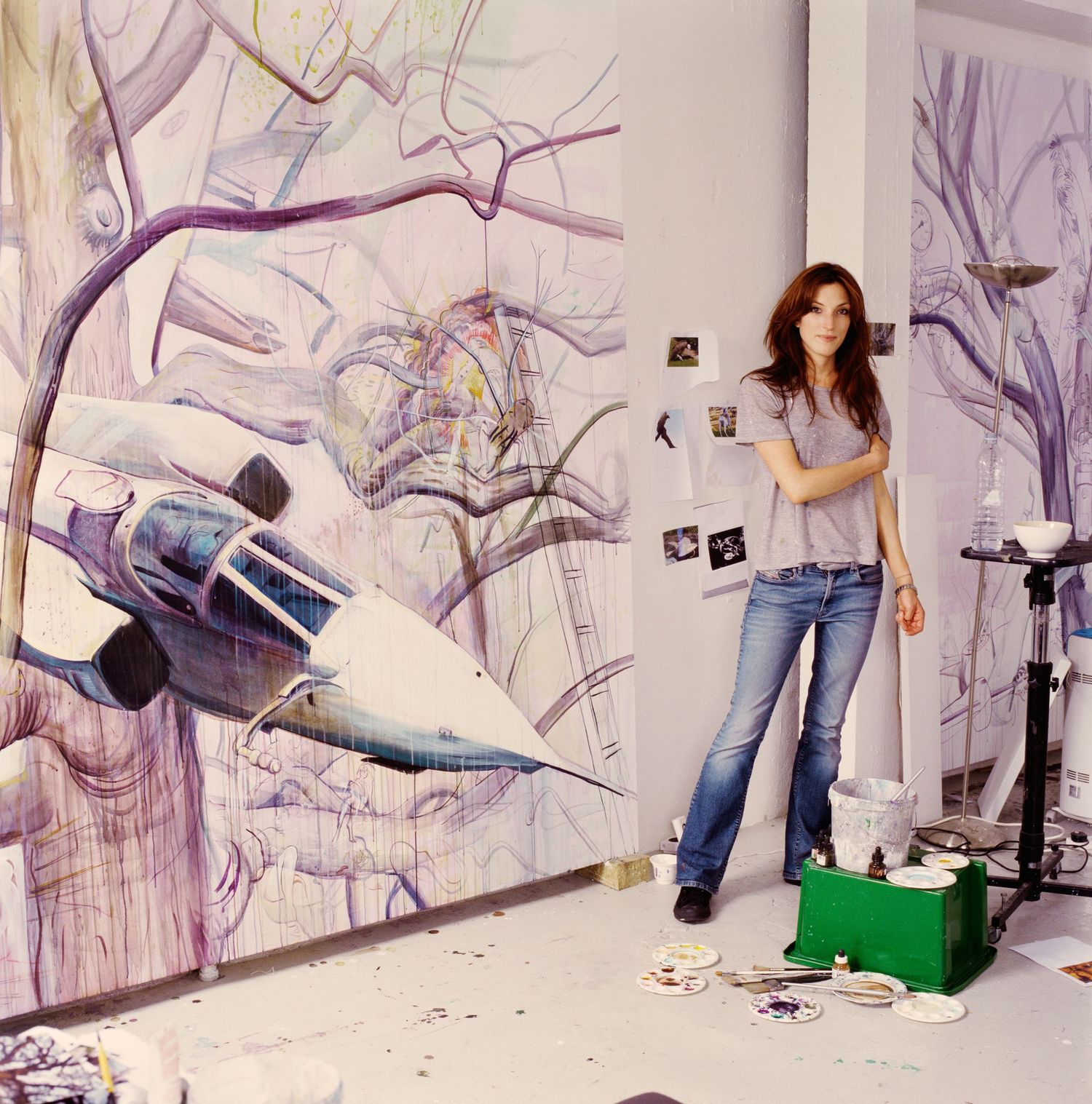 Artist creating dynamic abstract drawings on large paper in a studio space sequence.