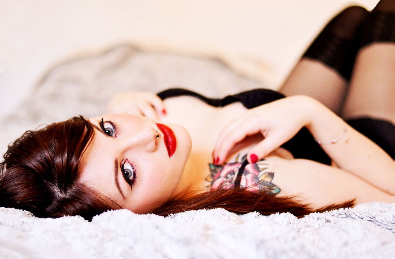 Dramatic boudoir photography series with moody lighting and red accents.