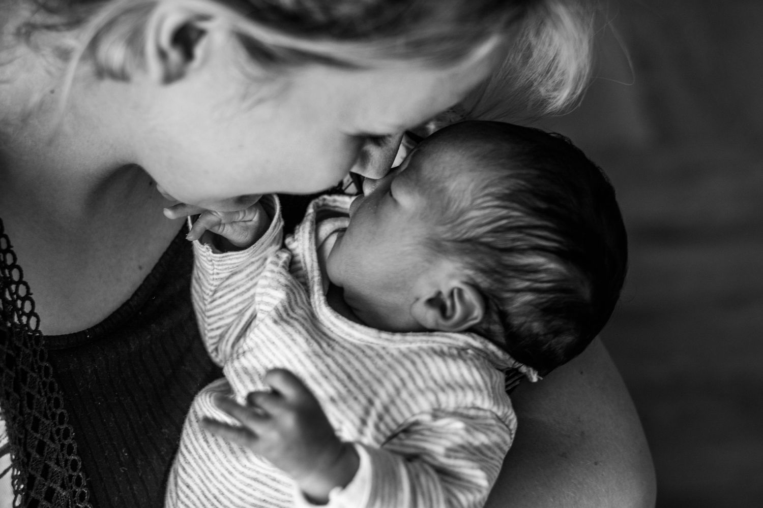 Black and white portrait of sleeping infant in peaceful repose.