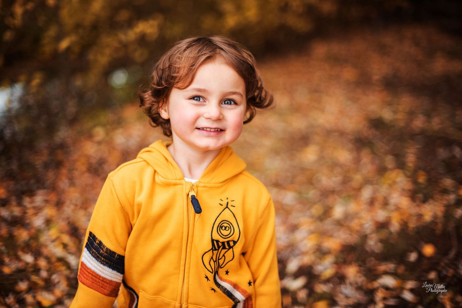 Autumn outdoor portrait session featuring orange clothing against fall foliage.
